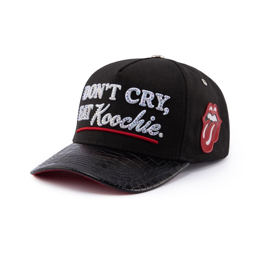 Black Goddess V3 at an angle: rhinestone front, red leather lips-and-tongue patch and snake-texture brim